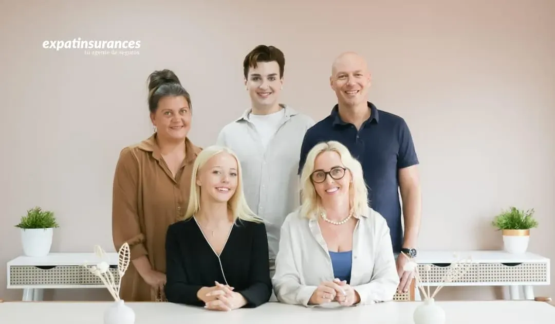 Expatinsurances broker team in Spain sitting together at a desk, ready to help expats with insurance